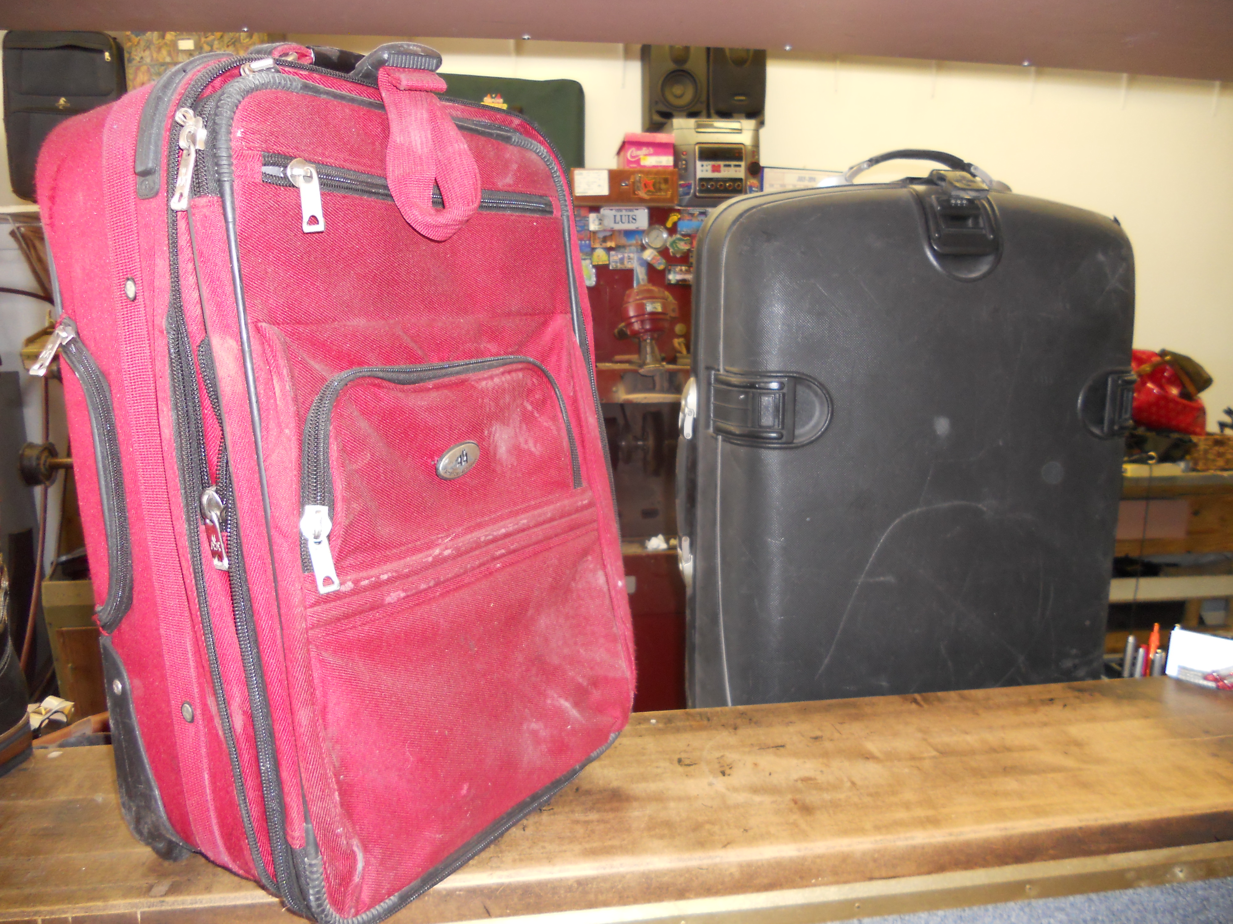 Soft-sided and hard-shell luggage brought in for repair at Shoe Express